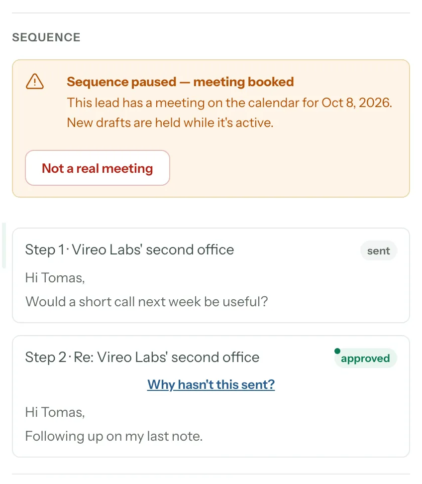 A lead's Sequence: Sequence paused — meeting booked, a meeting on the calendar for Oct 8, 2026, the Not a real meeting button, and the two steps below